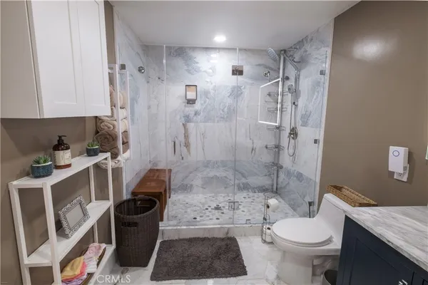 a work room with furniture and a floor to ceiling window