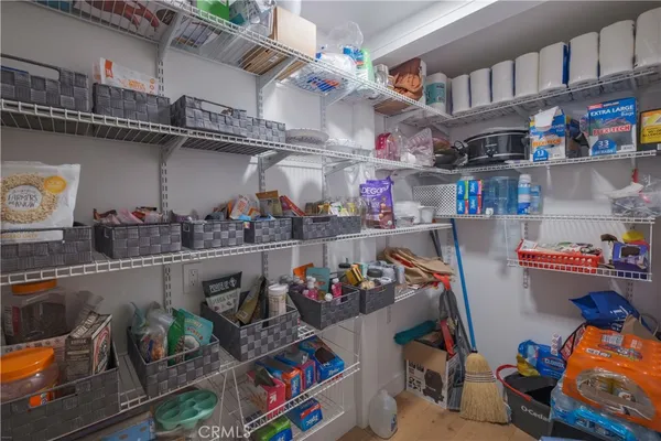 a bathroom with a toilet and a shower curtain