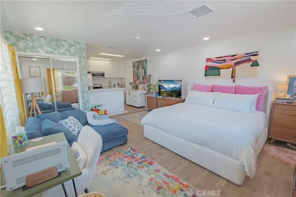 a view of a house with a backyard patio and sitting area
