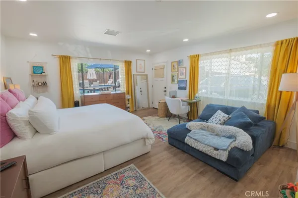 a view of a house with a backyard and a patio