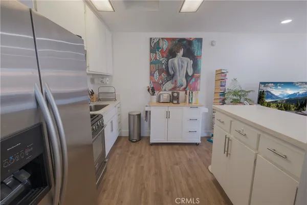 a view of a house with swimming pool and sitting area