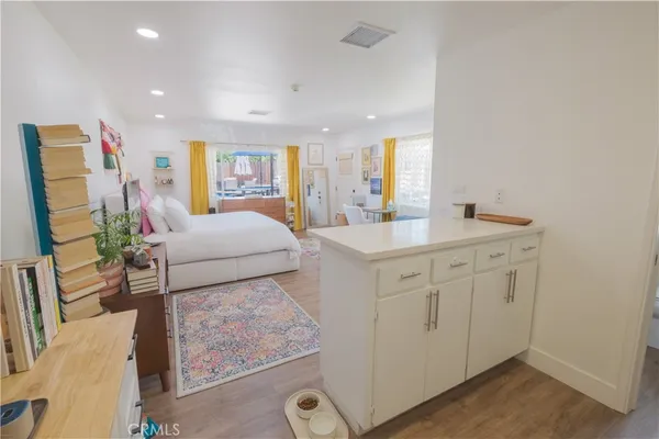 a view of a house with swimming pool and porch