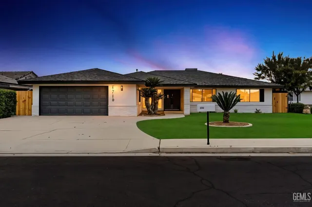 a front view of a house with yard