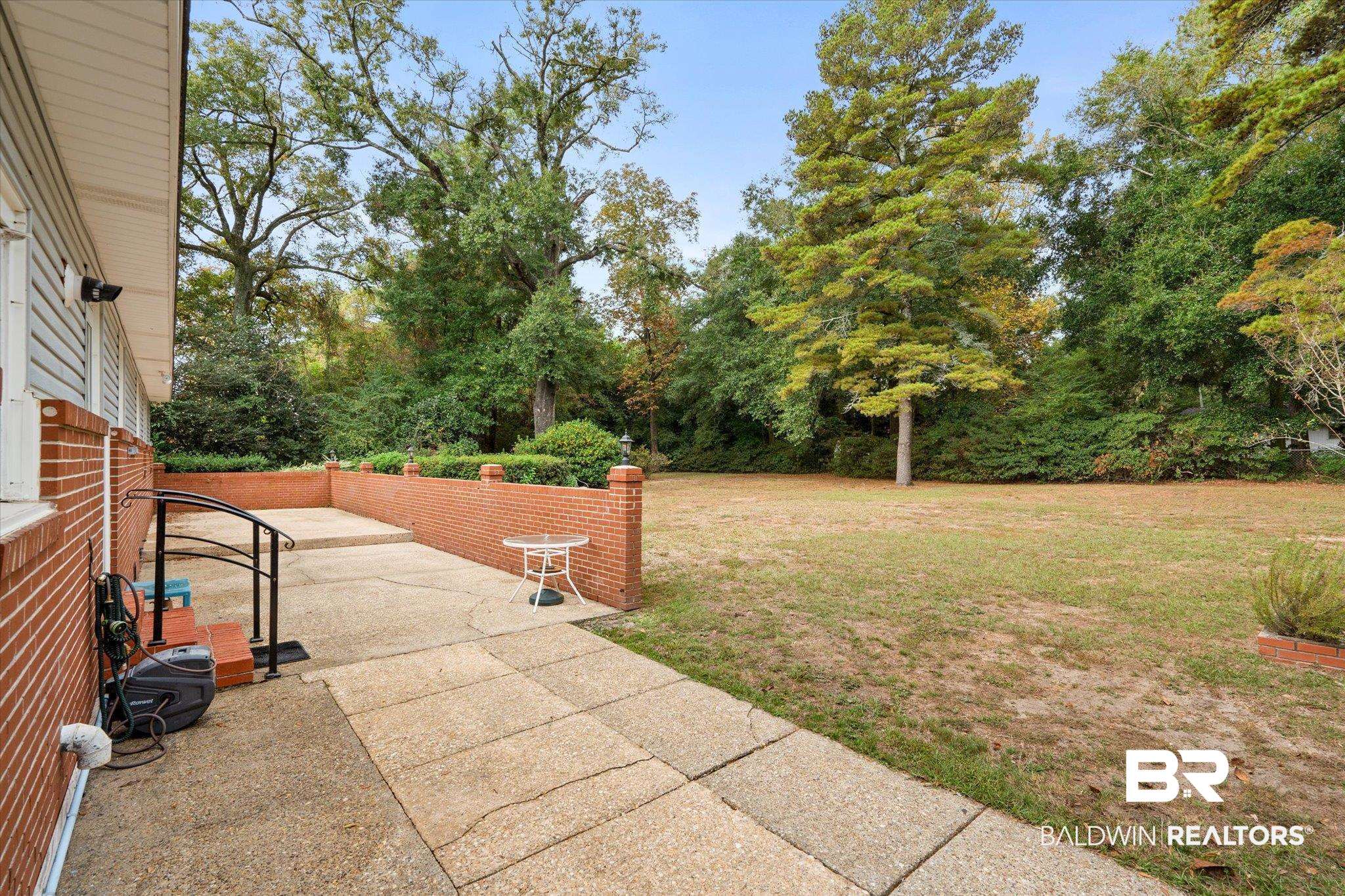 162 Bit And Spur Terrace Mobile, AL 36608 - Photo 22 of 29 View of yard featuring a patio