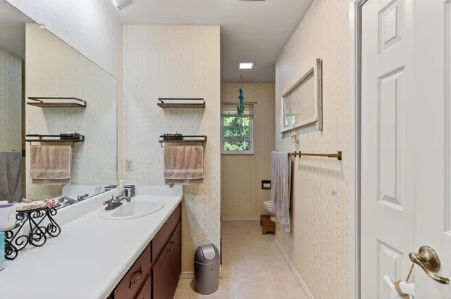 a bathroom with a sink double vanity and a mirror
