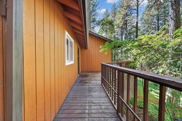 a view of a balcony with wooden floor