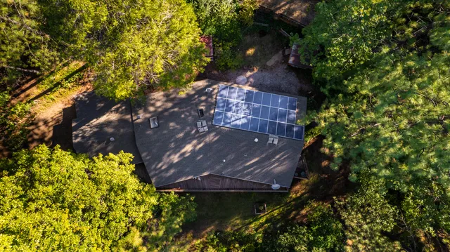 a view of house with a yard