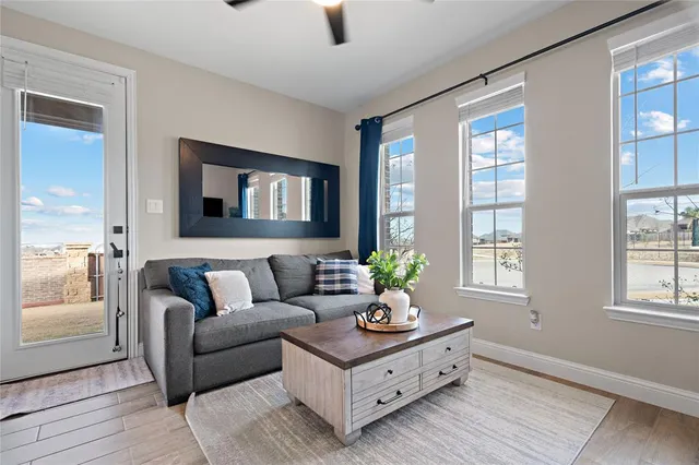 a living room with furniture and windows