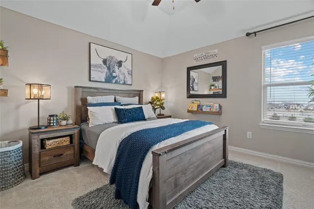 a bed room with a bed and a night stand