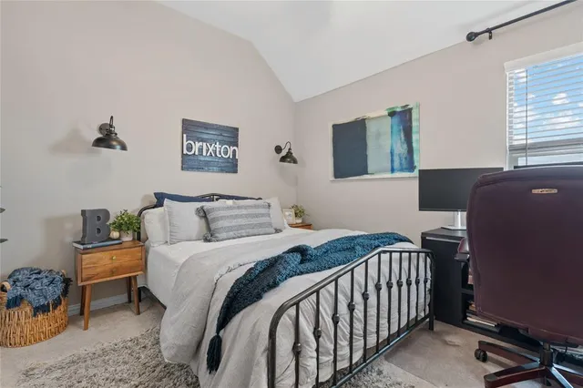 a bedroom with a bed and a couch