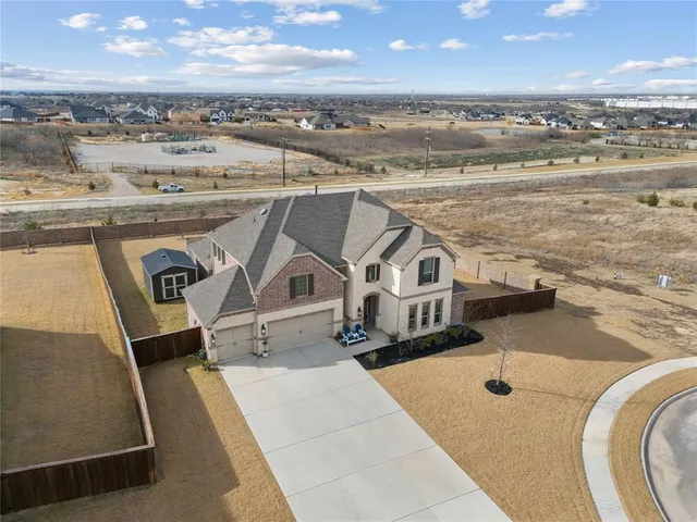 an aerial view of a house with a ocean view