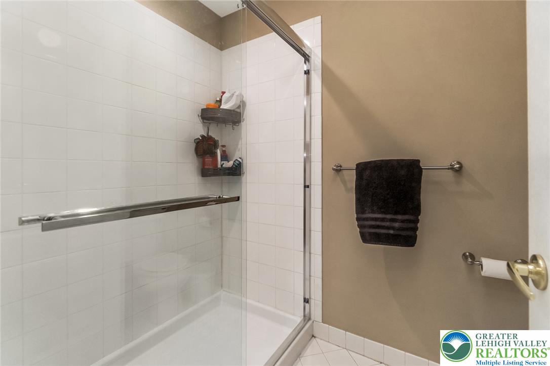 3566 Penfield Way Nazareth, PA 18064 - Photo 44 of 47 A well-maintained shower with crisp white tiling and glass enclosure offers a fresh start to your day.