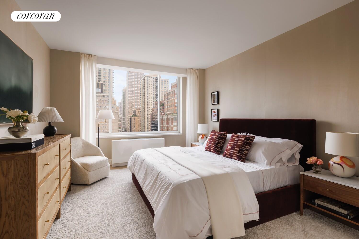 400 East 84th Street, Unit 22C Manhattan, NY 10028 - Photo 6 of 10 a bedroom with a bed and a large window