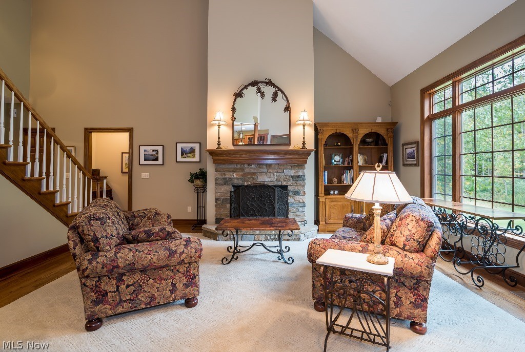 16277 Snyder Road Chagrin Falls, OH 44022 - Photo 8 of 35 Grand two story great room with stone fireplace and wall of windows