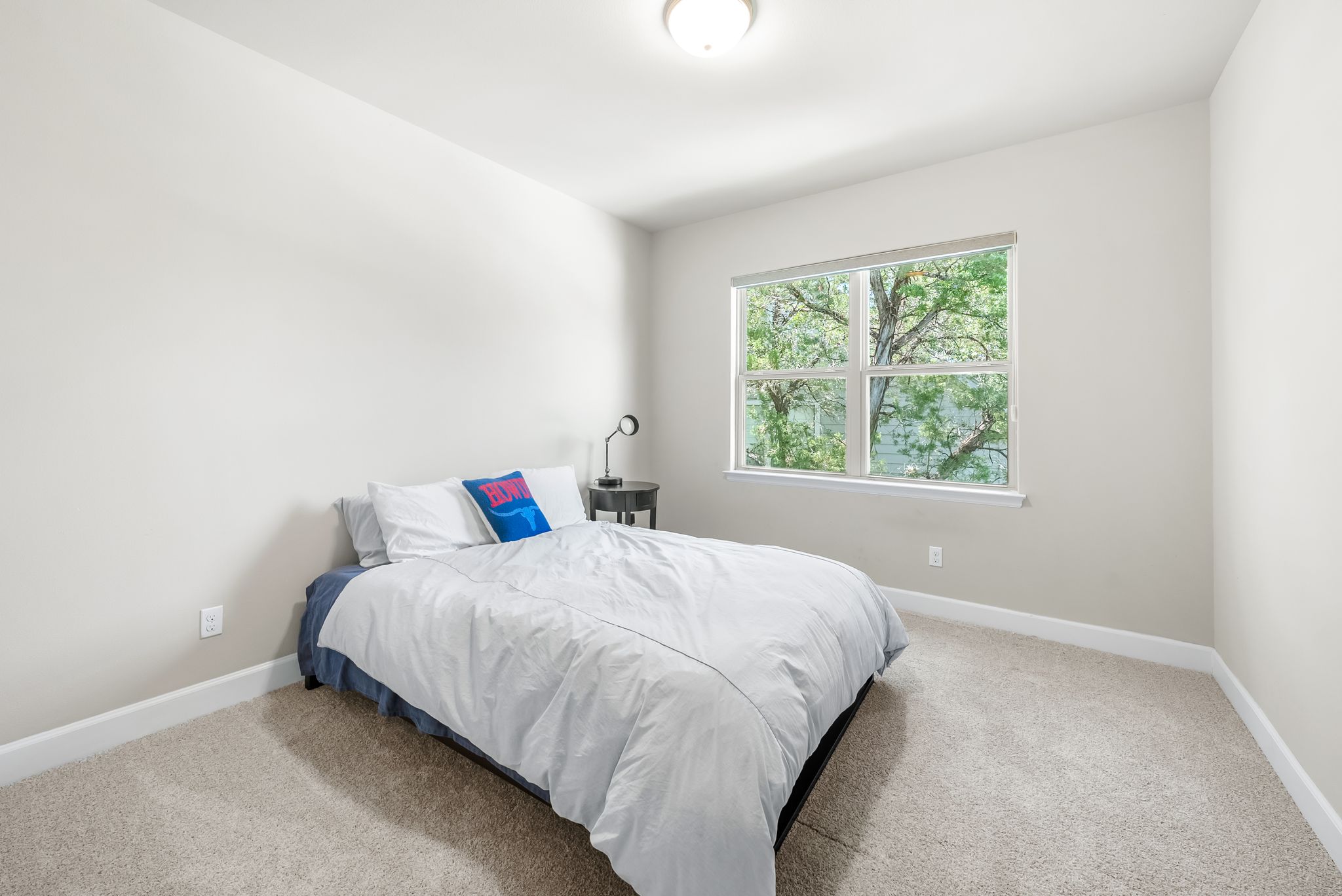 14213 Red Feather Trail Austin, TX 78734 - Photo 25 of 39 a bedroom with a bed and window