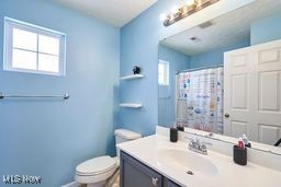 37478 Sandy Ridge Drive North Ridgeville, OH 44039 - Photo 20 of 27 Bathroom with walk in shower, vanity, and toilet