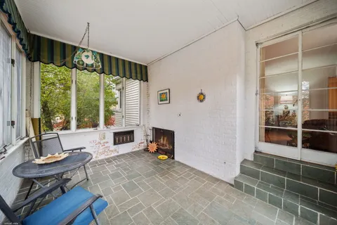 a living room with furniture windows and a fireplace