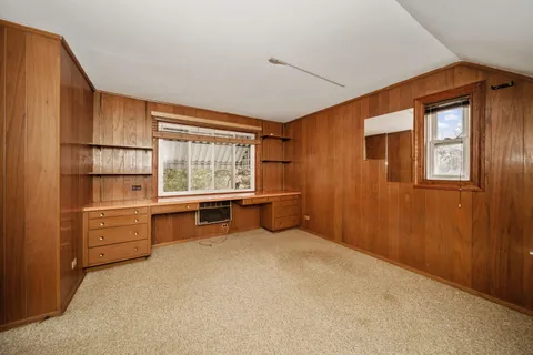 a room with window and furniture