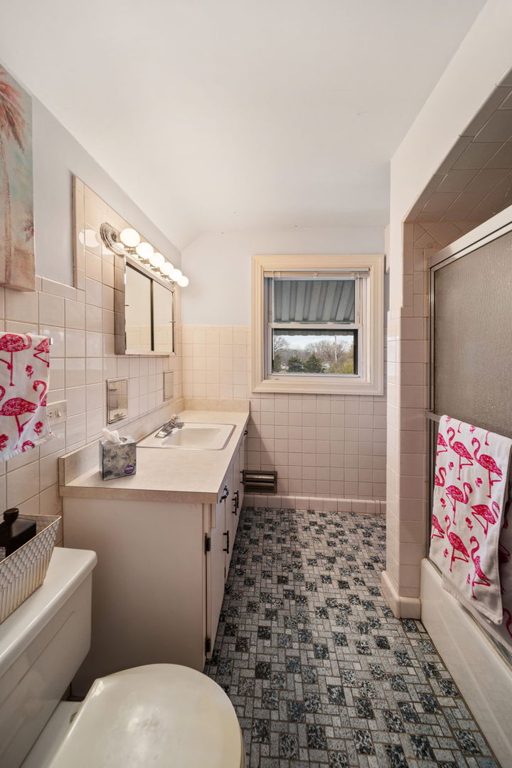 2619 York Road Oak Brook, IL 60523 - Photo 26 of 41 a bathroom with a sink toilet and shower