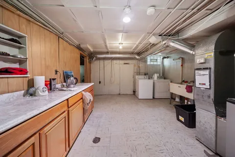 a view of a house with a yard and garage
