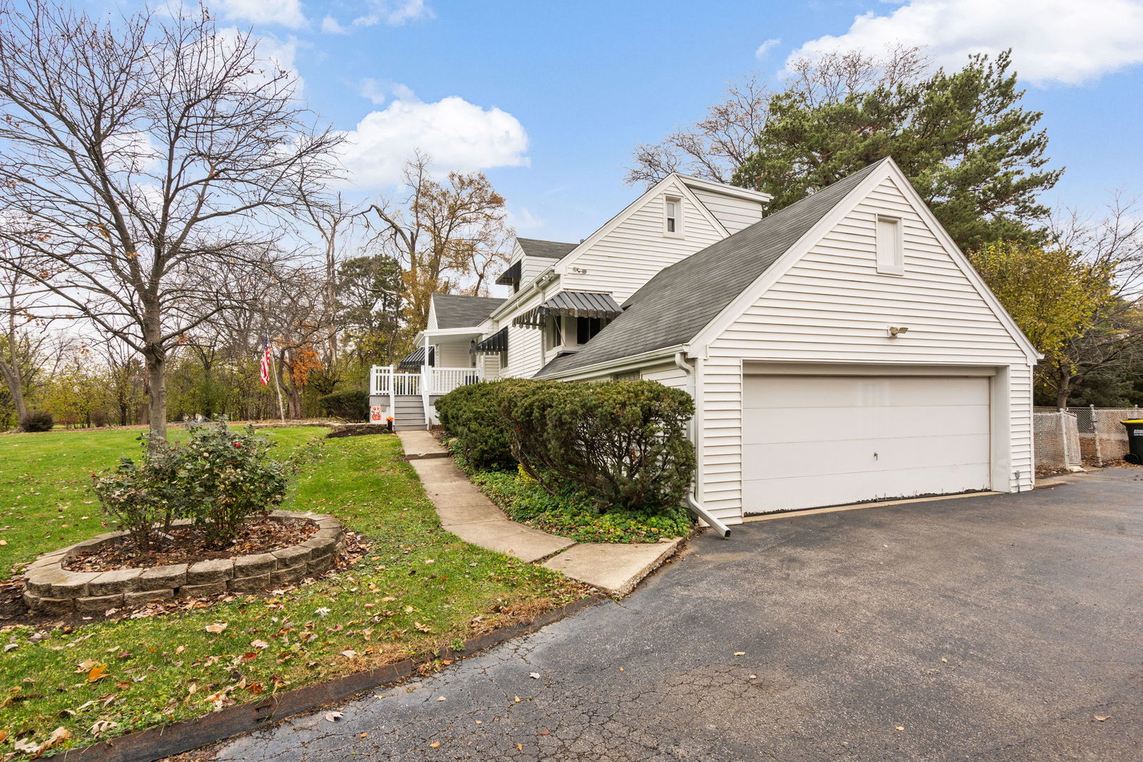 2619 York Road Oak Brook, IL 60523 - Photo 31 of 41 a view of a house with a yard and garage