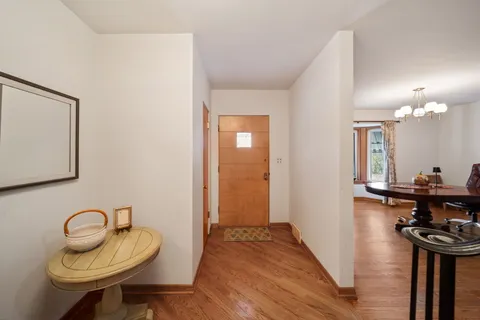 a view of a livingroom with furniture and a mirror