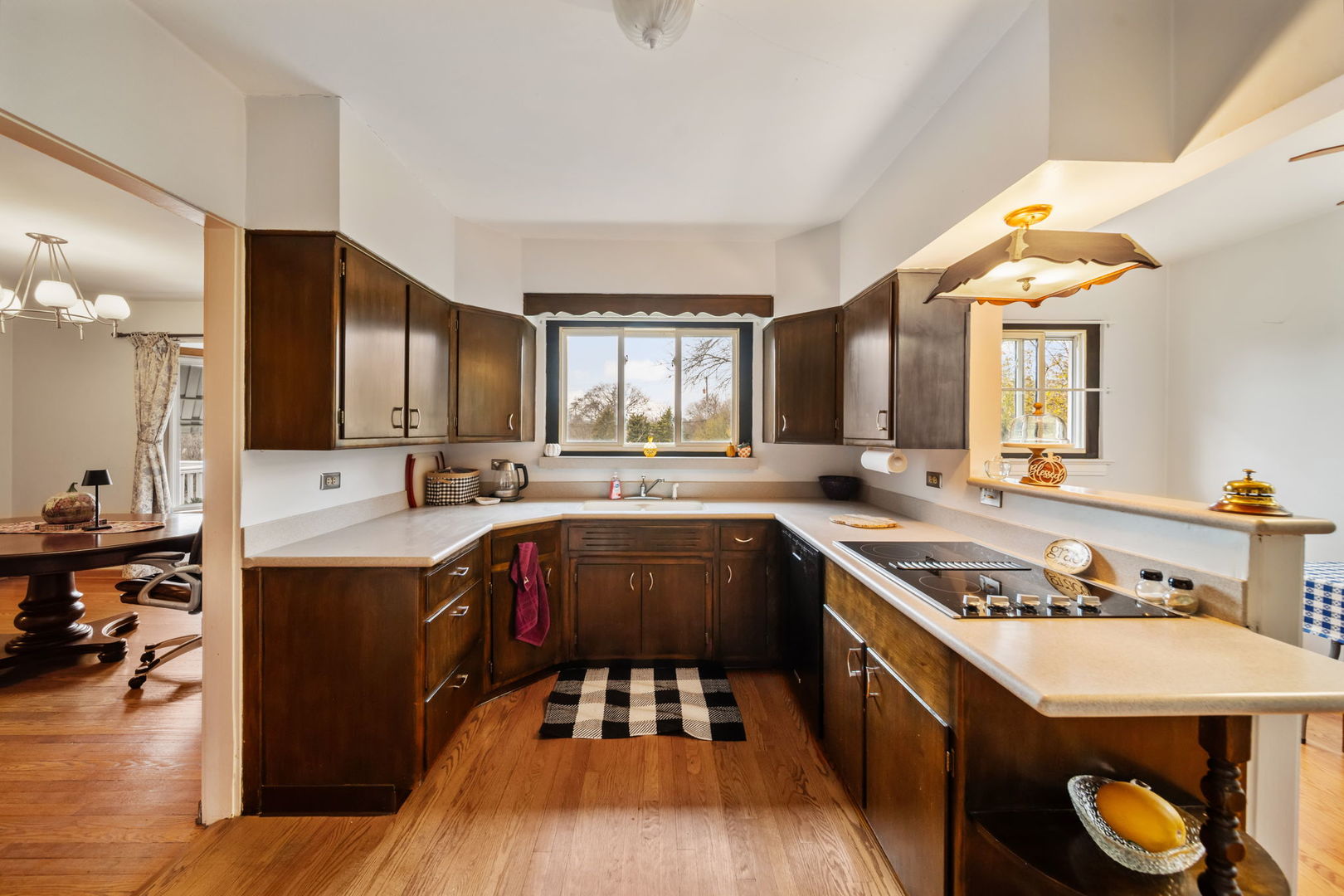 2619 York Road Oak Brook, IL 60523 - Photo 9 of 41 a kitchen with stainless steel appliances a stove a sink dishwasher and cabinets with wooden floor