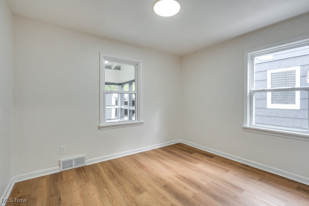 4237 Verona Road Cleveland, OH 44121 - Photo 15 of 41 Spare room with light wood-type flooring and plenty of natural light