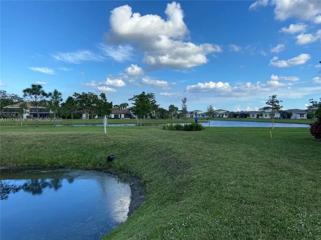 a view of a golf course with a lake