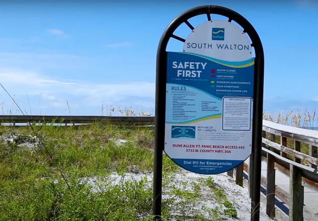 a view of a wooden door with a bench in the background