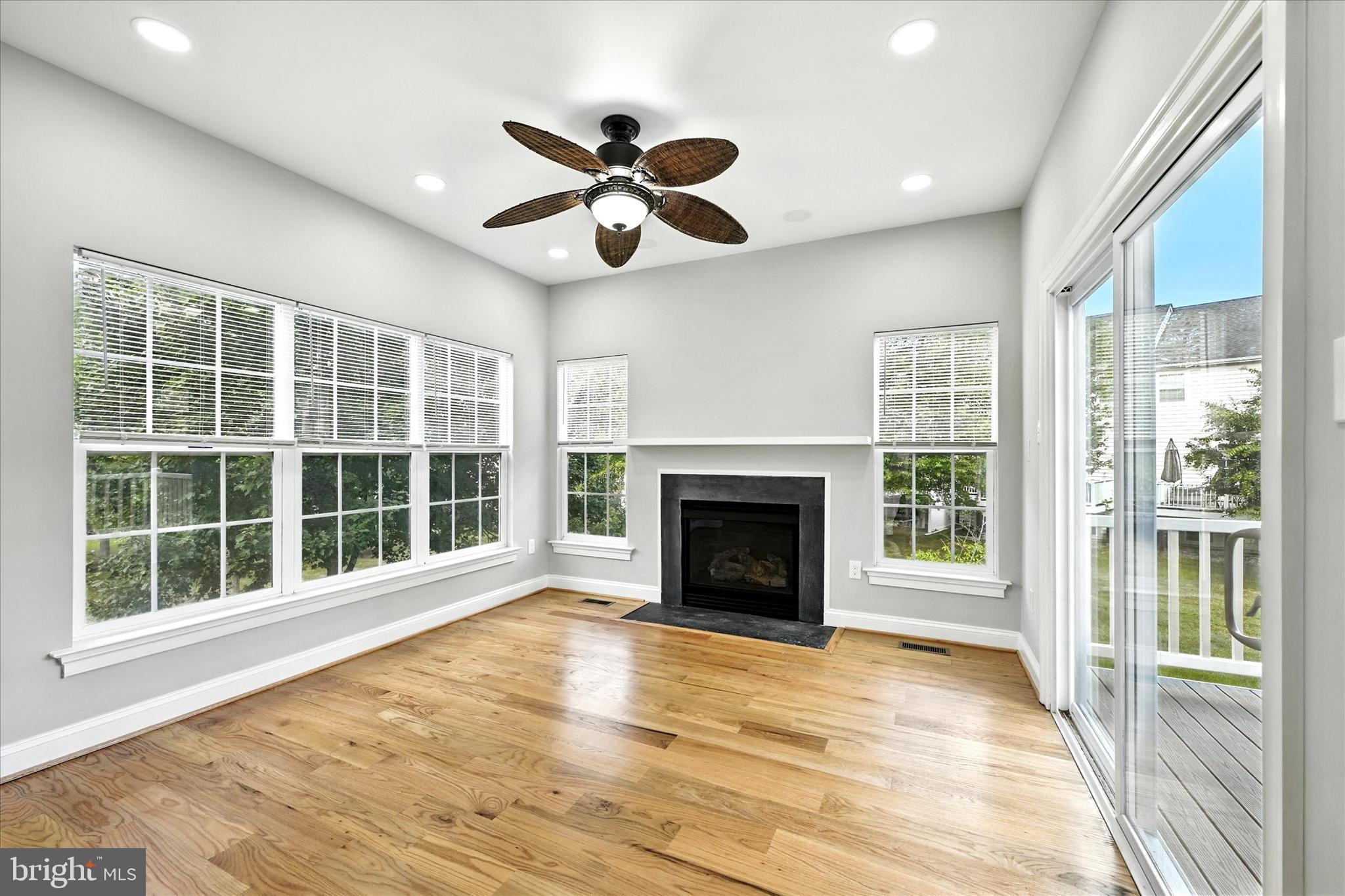 9828 Snow Bird Lane Laurel, MD 20723 - Photo 11 of 30 a view of an empty room with wooden floor and a window