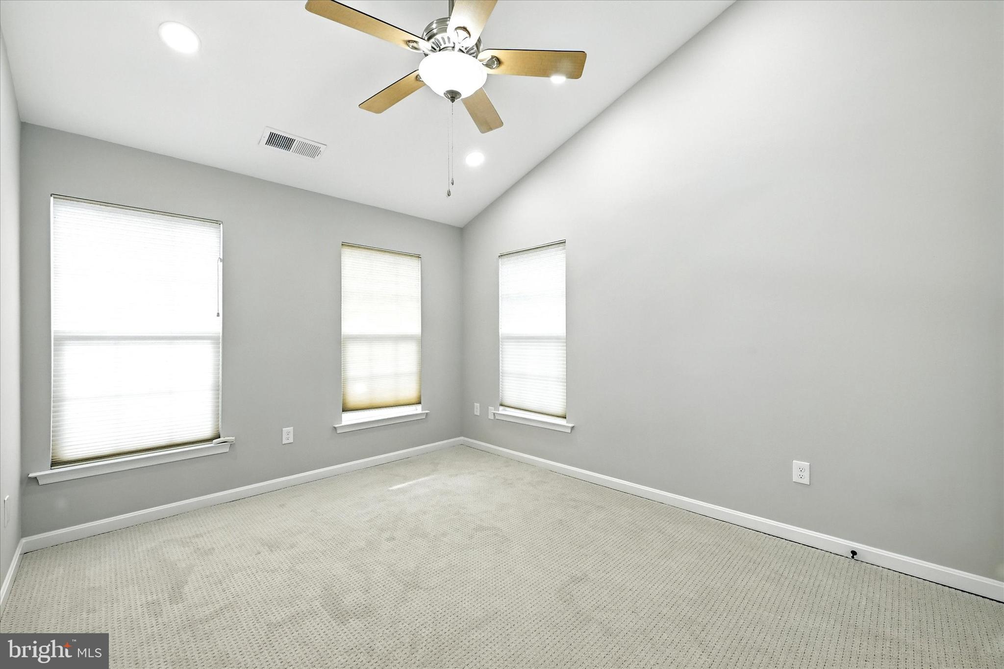 9828 Snow Bird Lane Laurel, MD 20723 - Photo 17 of 30 an empty room with windows and fan