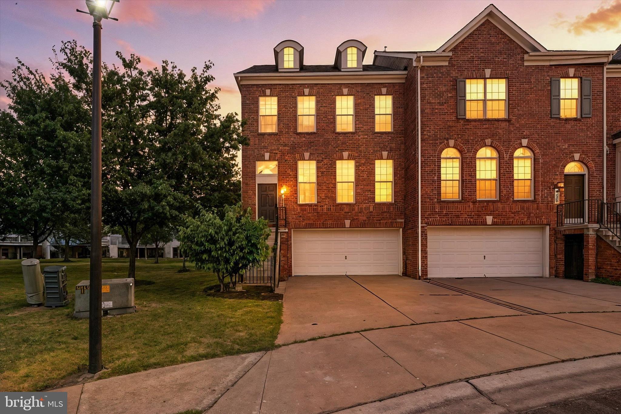 9828 Snow Bird Lane Laurel, MD 20723 - Photo 3 of 30 a view of a brick house with many windows