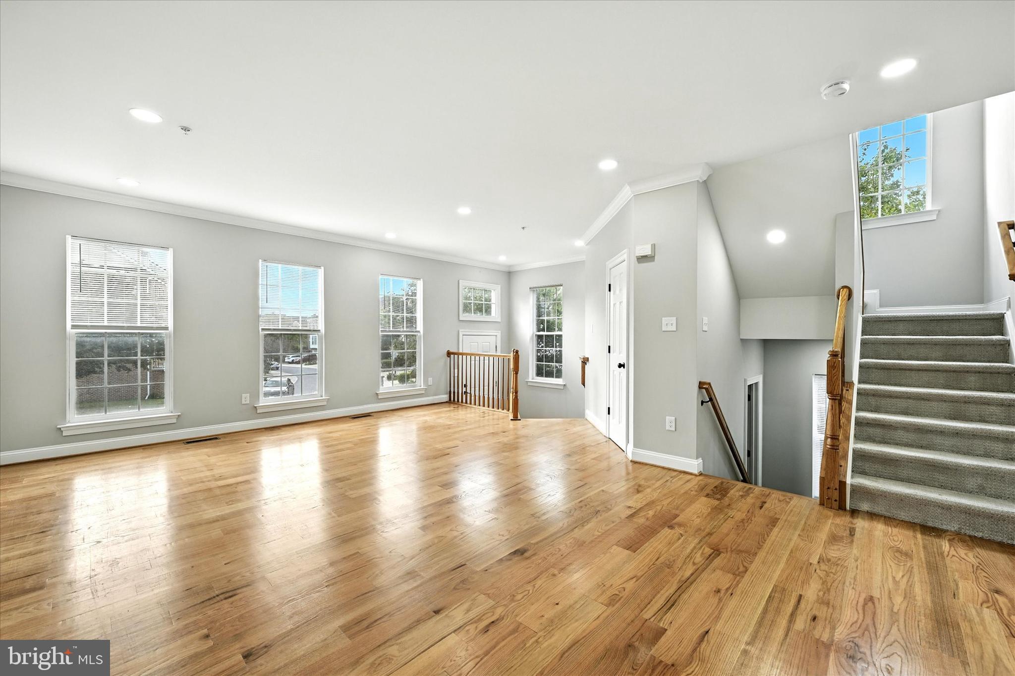 9828 Snow Bird Lane Laurel, MD 20723 - Photo 4 of 30 a view of an empty room with wooden floor and a window
