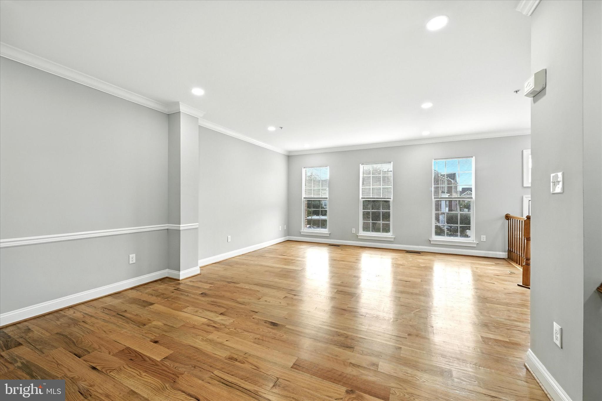 9828 Snow Bird Lane Laurel, MD 20723 - Photo 7 of 30 wooden floor in an empty room with a window