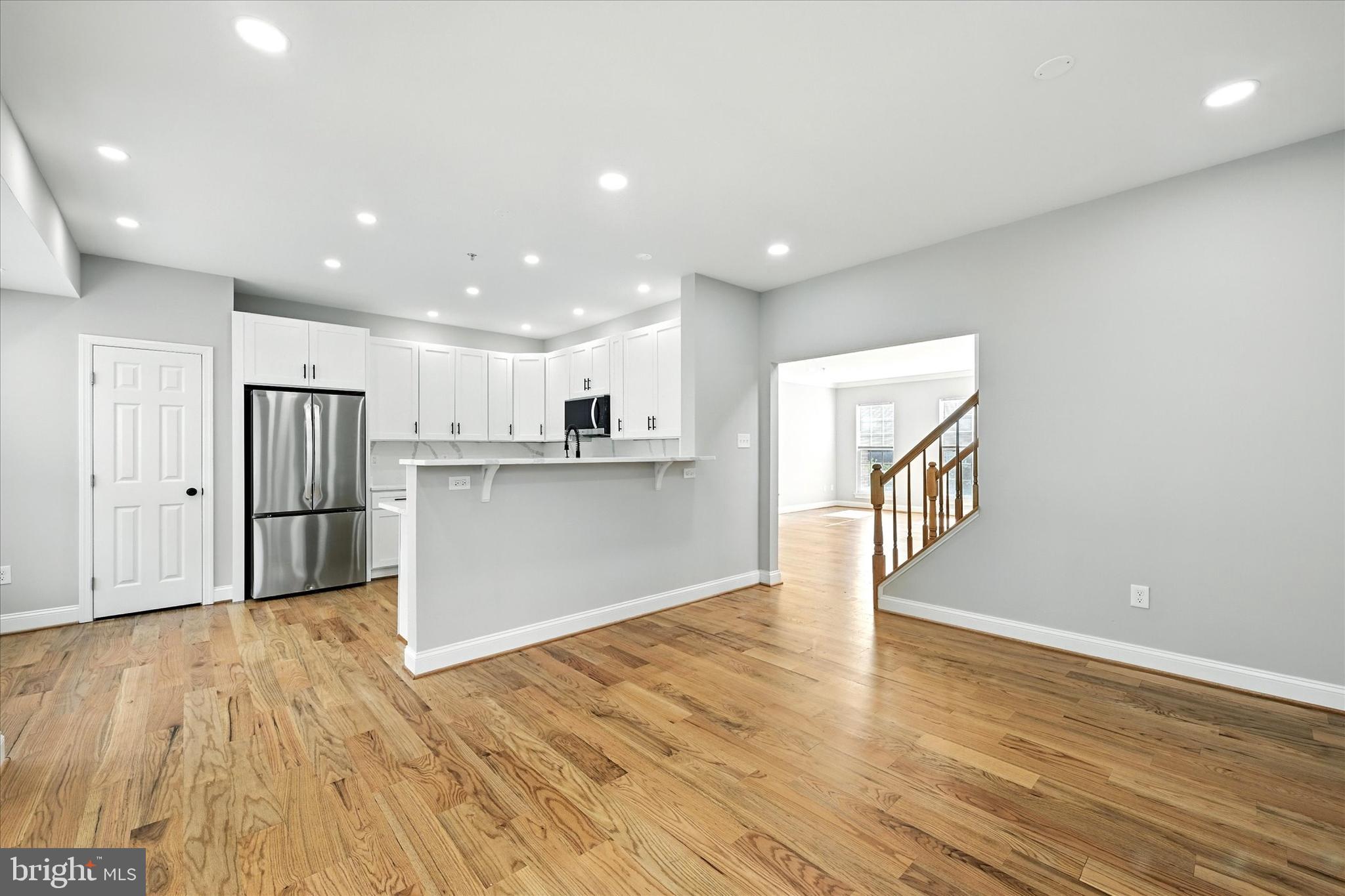 9828 Snow Bird Lane Laurel, MD 20723 - Photo 9 of 30 a view of kitchen with wooden floor