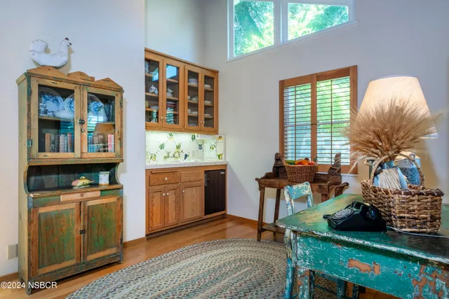 a bedroom with furniture and a window