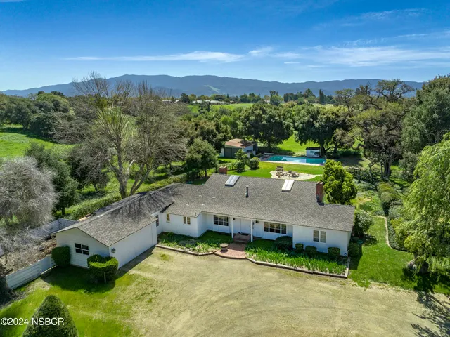 an aerial view of a house with a garden