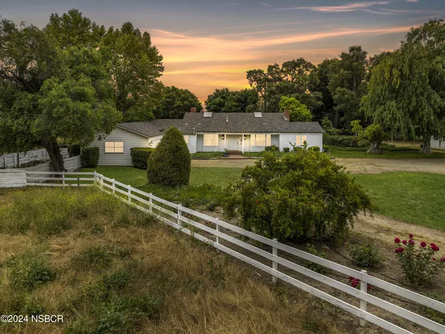 a view of a swimming pool with a garden