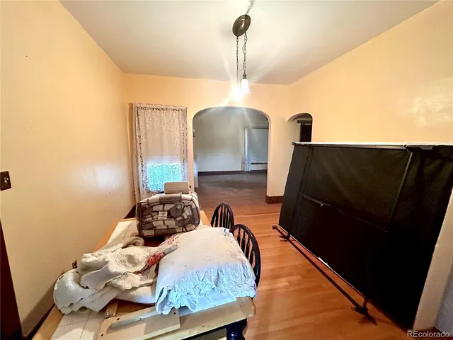 a bedroom with bed and a window