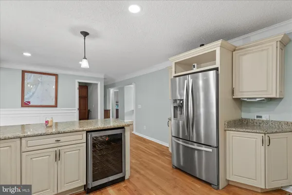 a bedroom with a bed and a dresser in it