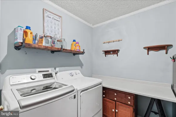 a spacious bedroom with a bed and glass window