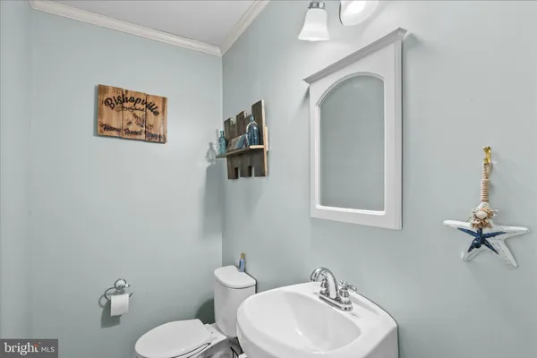 a bedroom with a bed and a ceiling fan