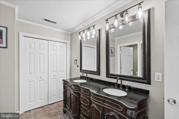 a view of a dining room with furniture and a window