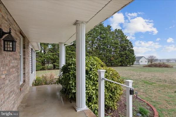 a kitchen with stainless steel appliances kitchen island granite countertop a refrigerator and microwave