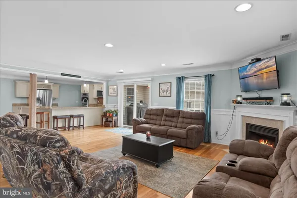 a view of a chair and table in the back yard of the house