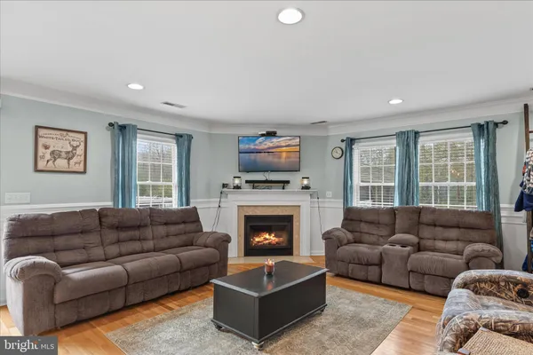 a view of a patio with table and chairs with wooden floor and fence