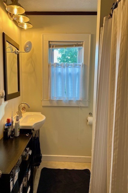 2 Pine Street Chicopee, MA 01020 - Photo 12 of 14 a bathroom with a sink and a mirror