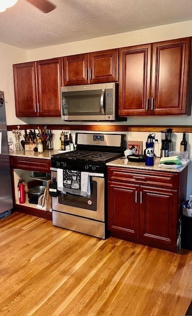 2 Pine Street Chicopee, MA 01020 - Photo 8 of 14 a kitchen with stainless steel appliances granite countertop a stove and cabinets