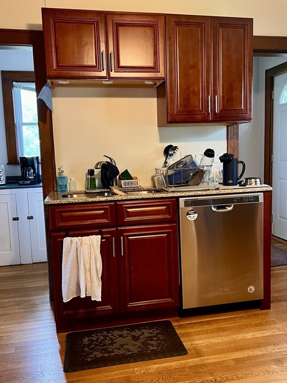2 Pine Street Chicopee, MA 01020 - Photo 9 of 14 a kitchen with granite countertop wooden cabinets and a counter top space